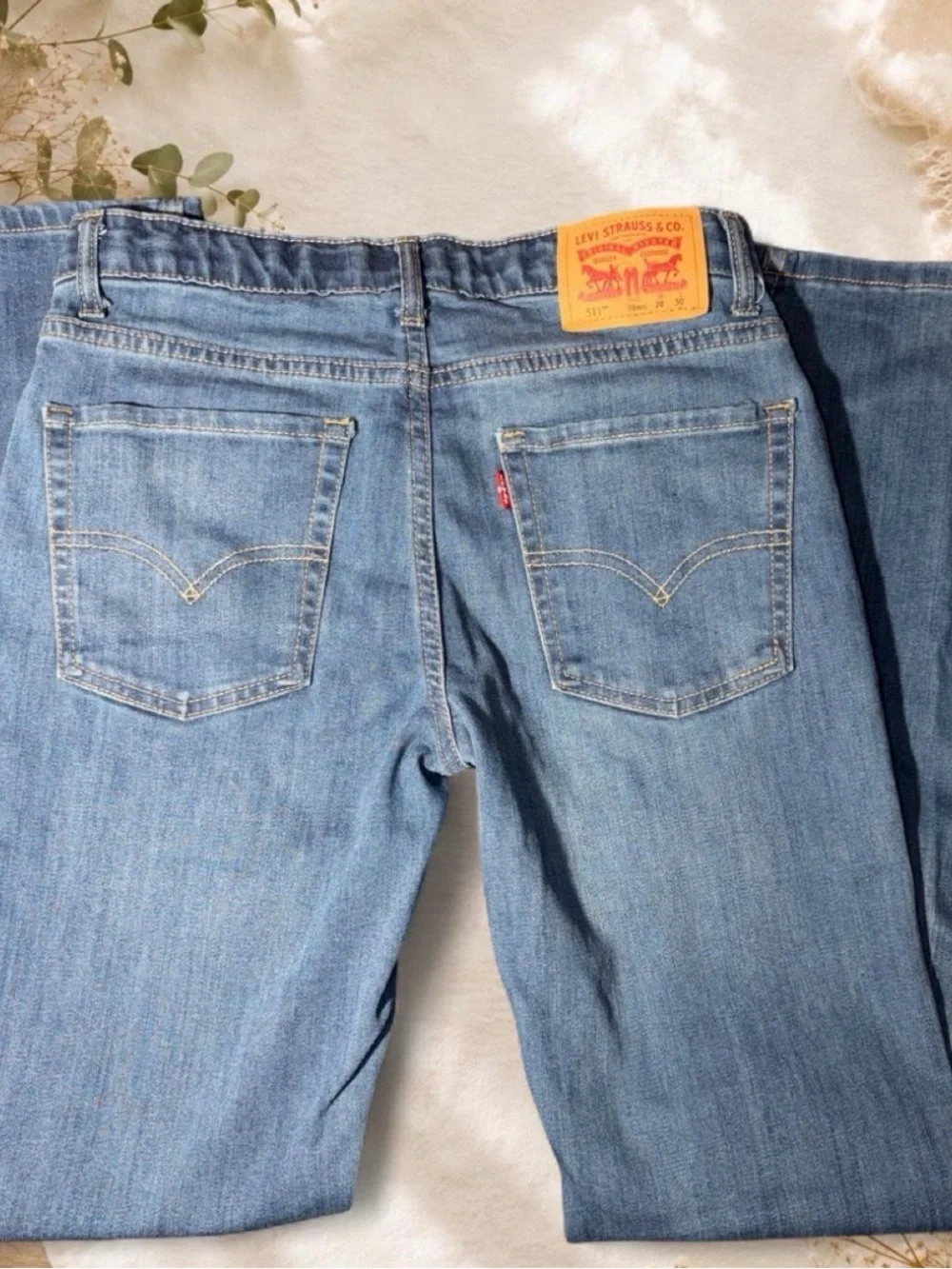Levi's Men's Light Denim Straight Jeans with Green Waistband Accent